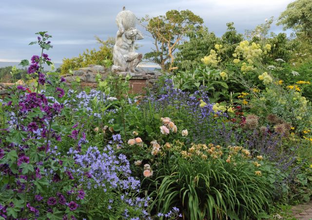 Evening sun flower bed atlas statue