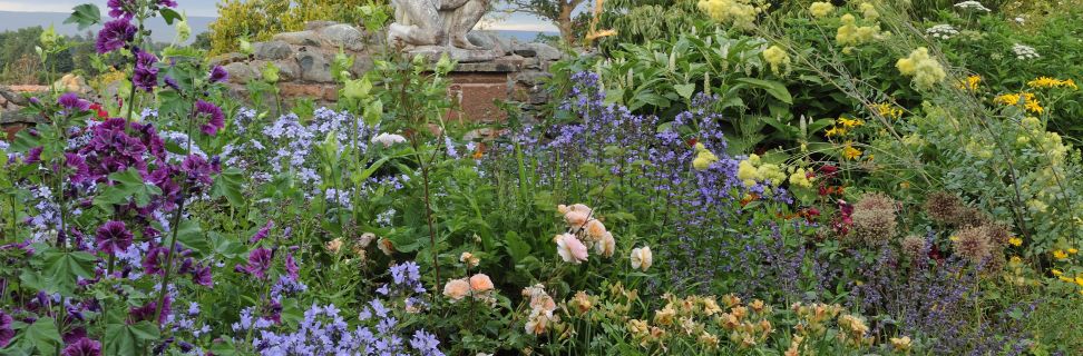 Evening sun flower bed atlas statue